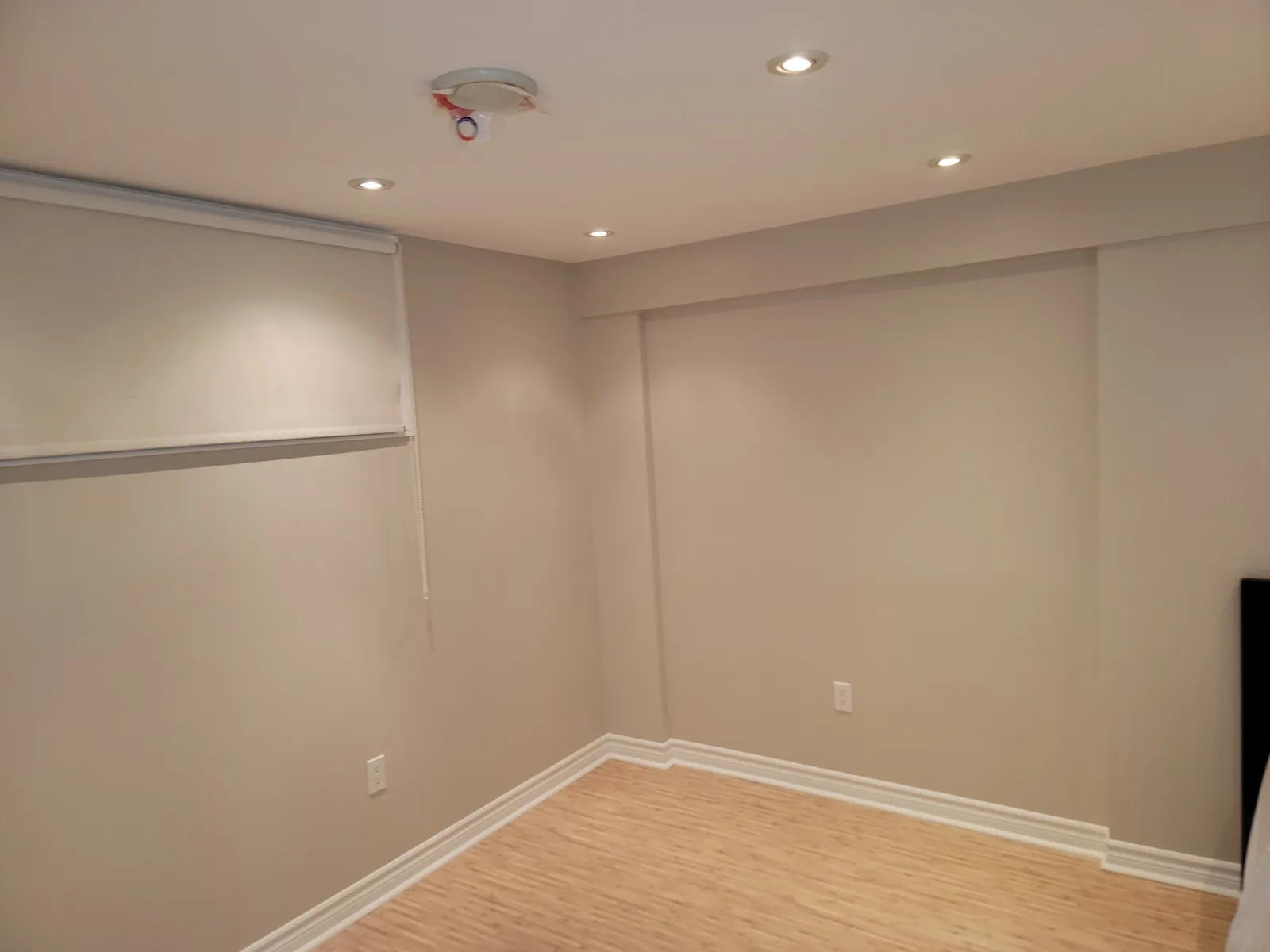 Finished basement or interior room with recessed lighting
