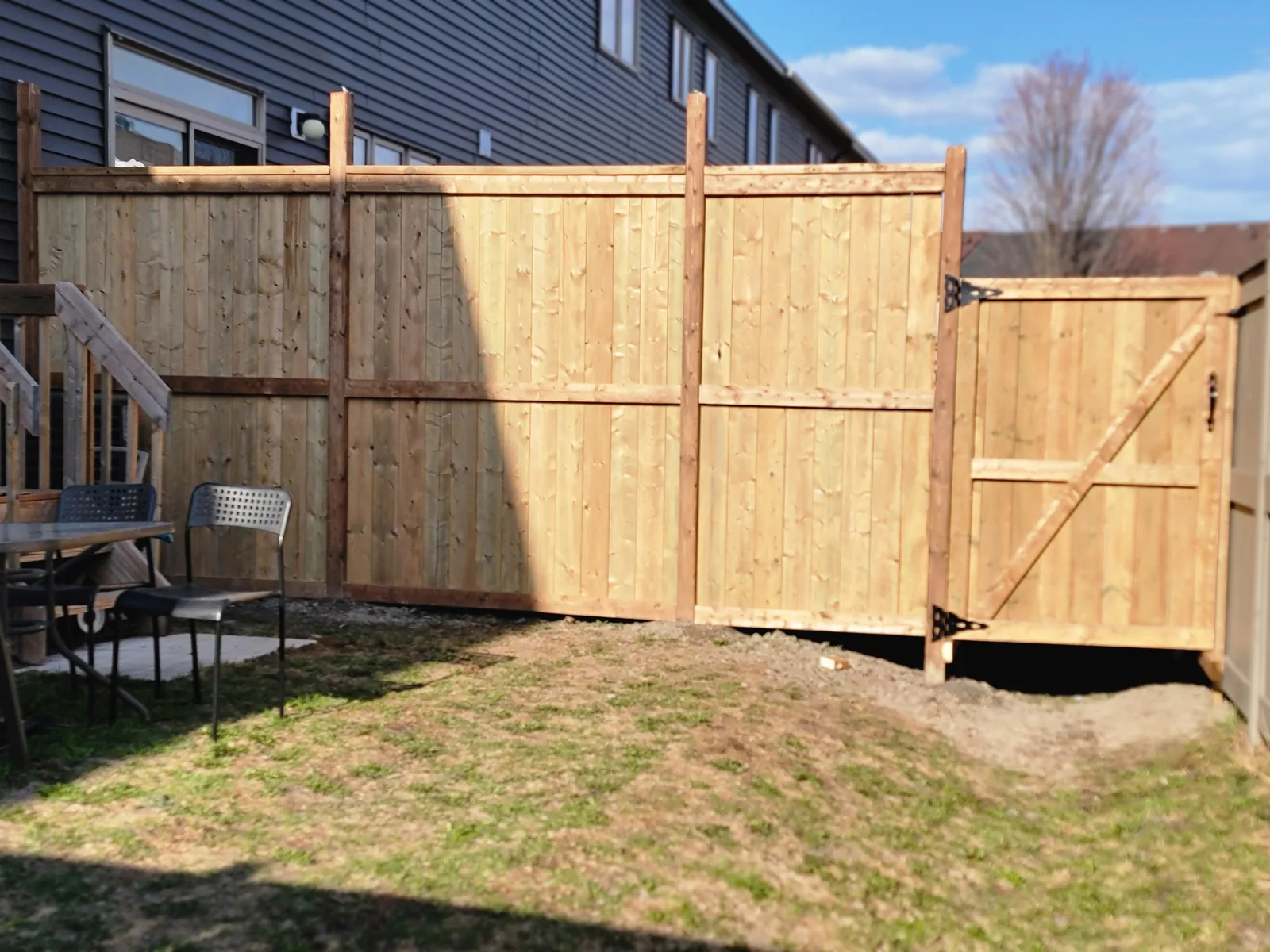 Wood privacy fence in a backyard