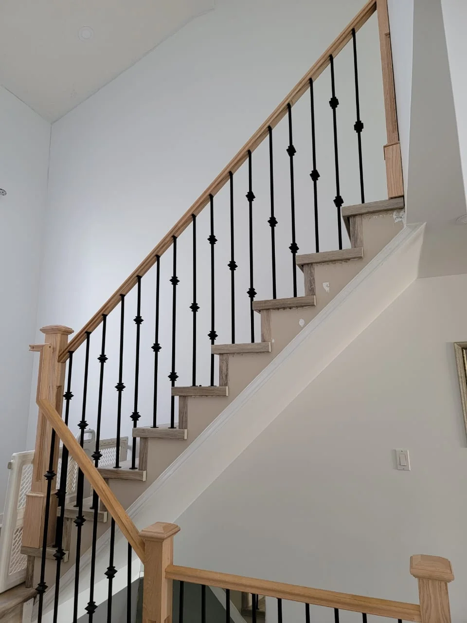 Upper staircase railing view
